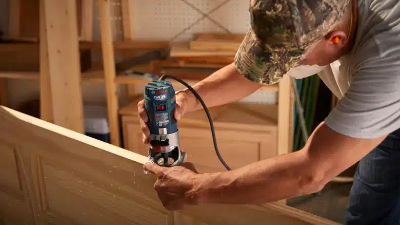Northern Tool client highlight: woodworker using a power router in a workshop