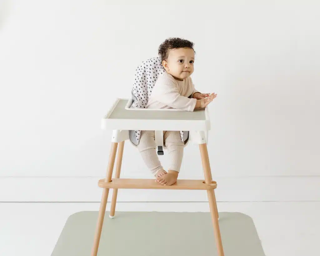 Yeah Baby Goods client highlight: baby leaning on a high chair tray